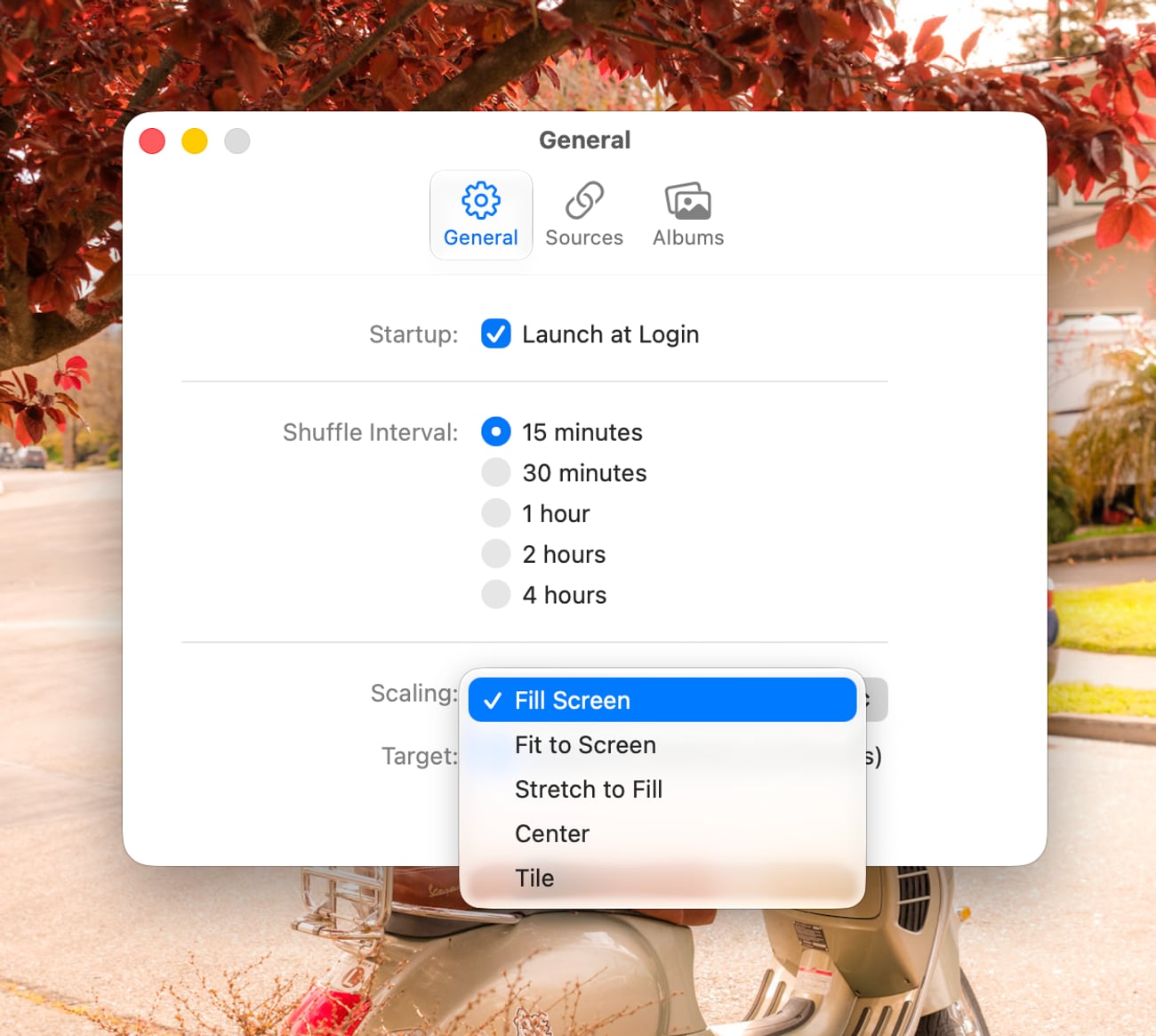PhotoDrift's General settings: Launch at Login, a shuffle interval from 15 minutes to 4 hours, and an open Scaling menu showing Fill Screen, Fit to Screen, Stretch to Fill, Center and Tile.